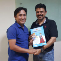 Abhijit giving Employee of the month certificate to shyam